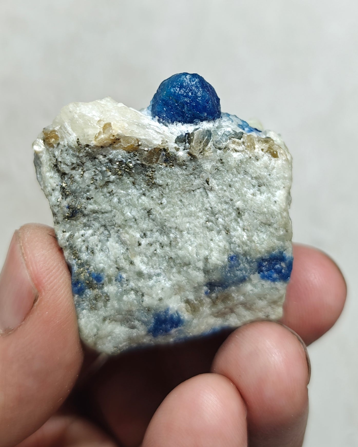 Fluorescent Afghanite/lazurite on matrix with pyrite 58 grams