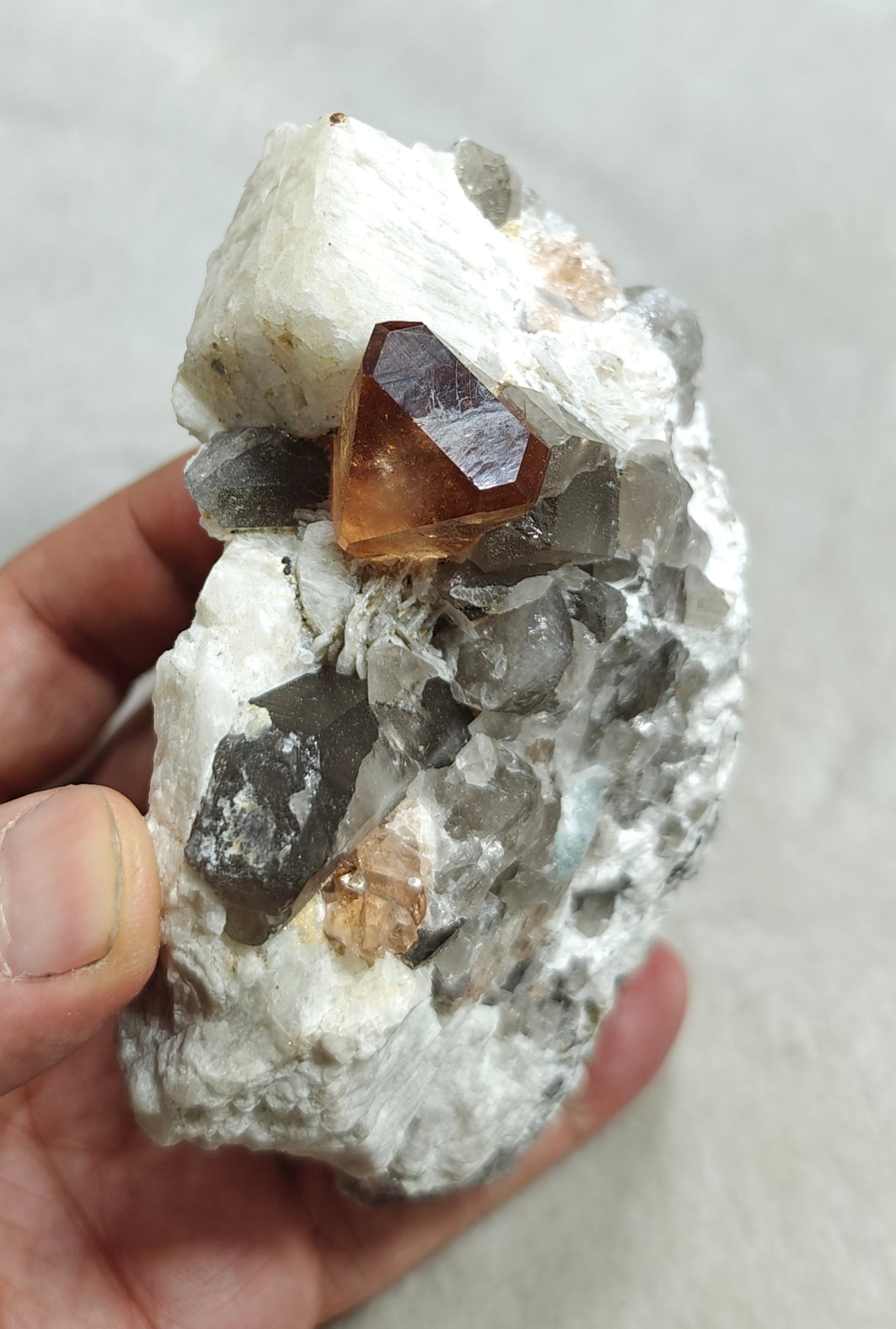 Terminated peach color Topaz crystal on matrix 576 grams