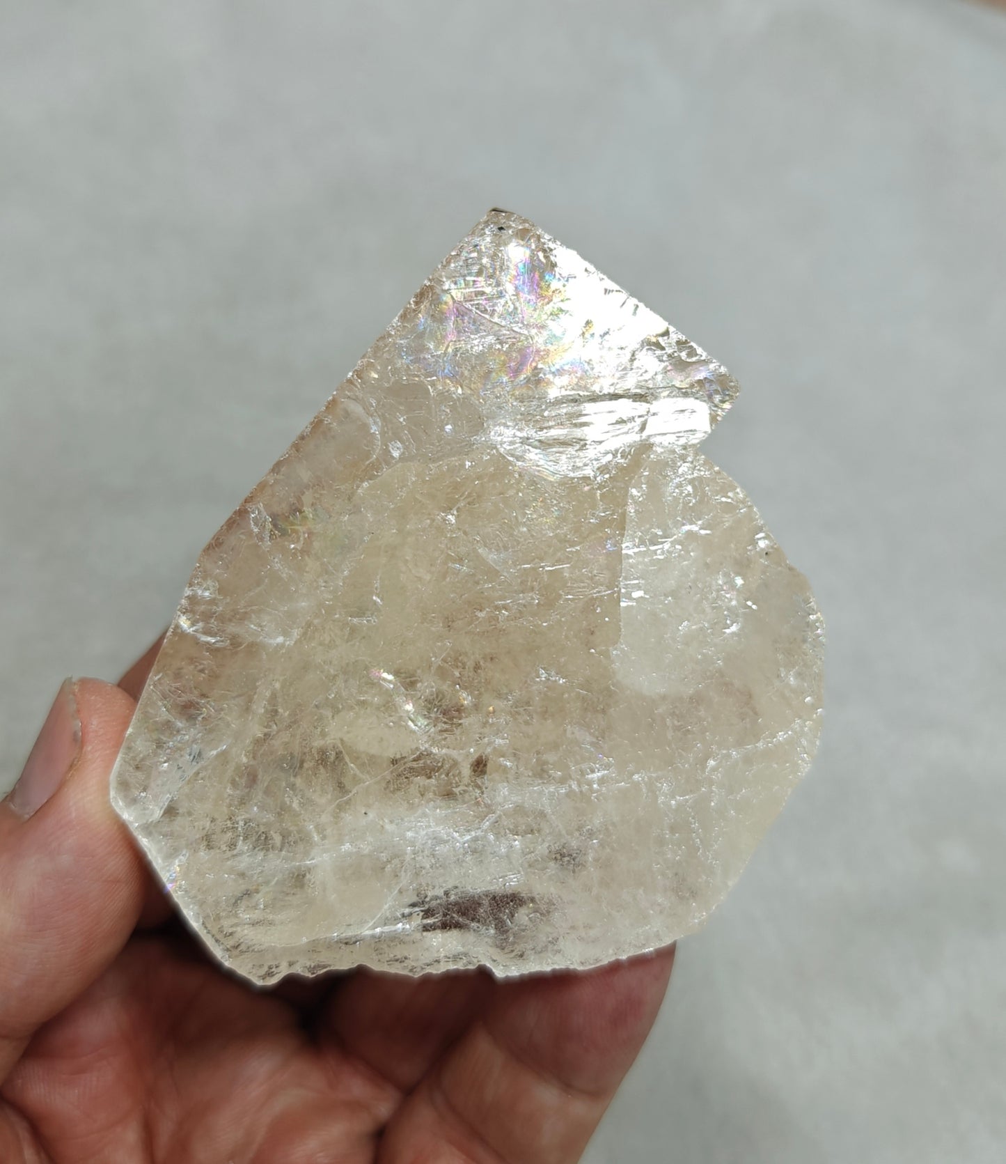 Natural light peach color Topaz crystal with rainbow effects with associated tourmaline 200 grams