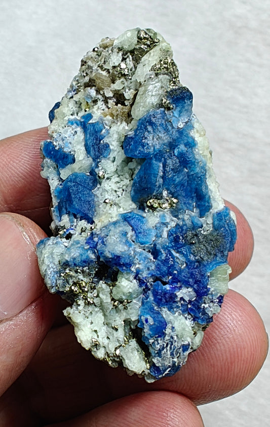 Afghanite Fluorescent in matrix with some pyrite and phlogopite 41 grams