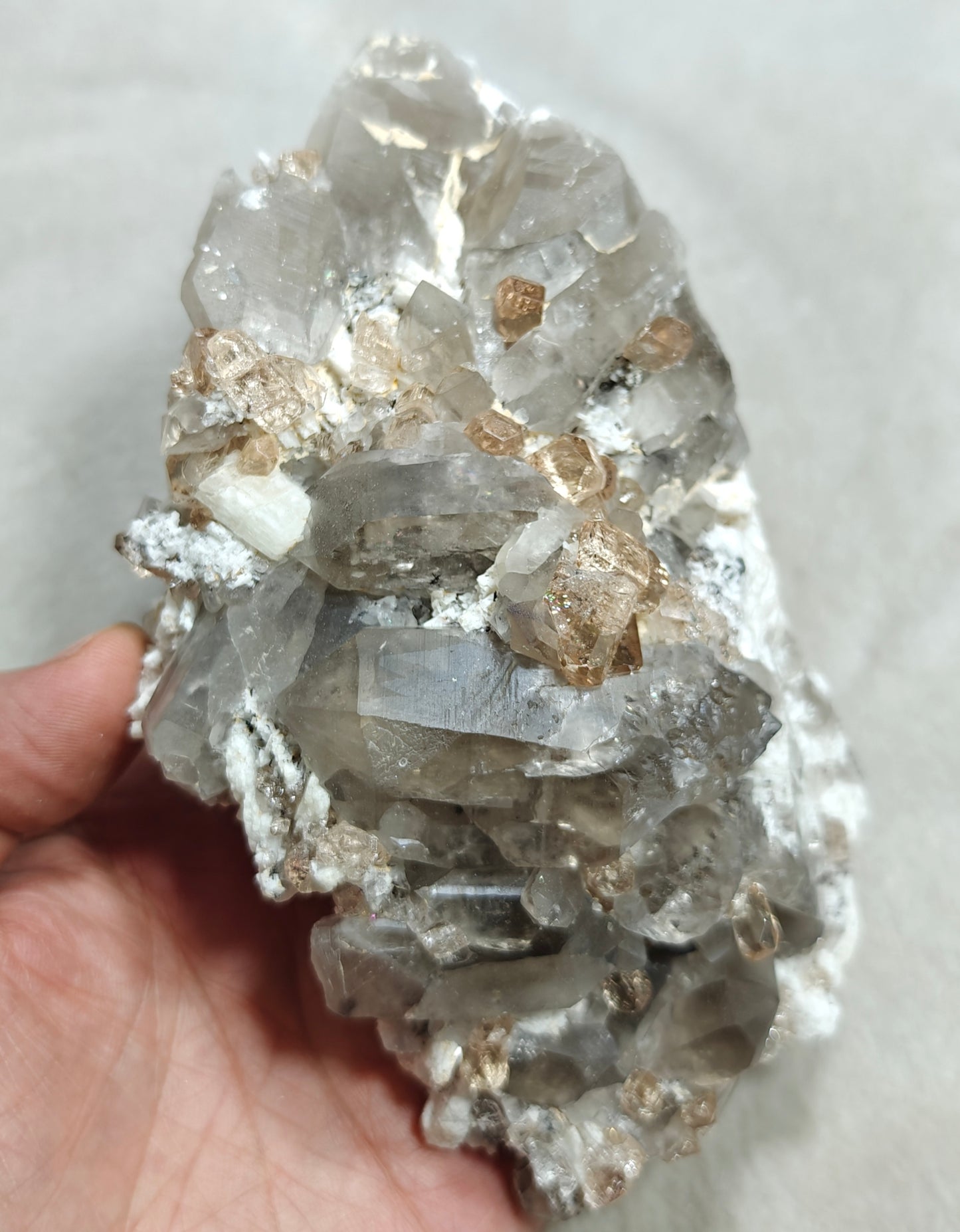 Natural terminated peach color Topaz crystals with smoky quartz on matrix 750 grams