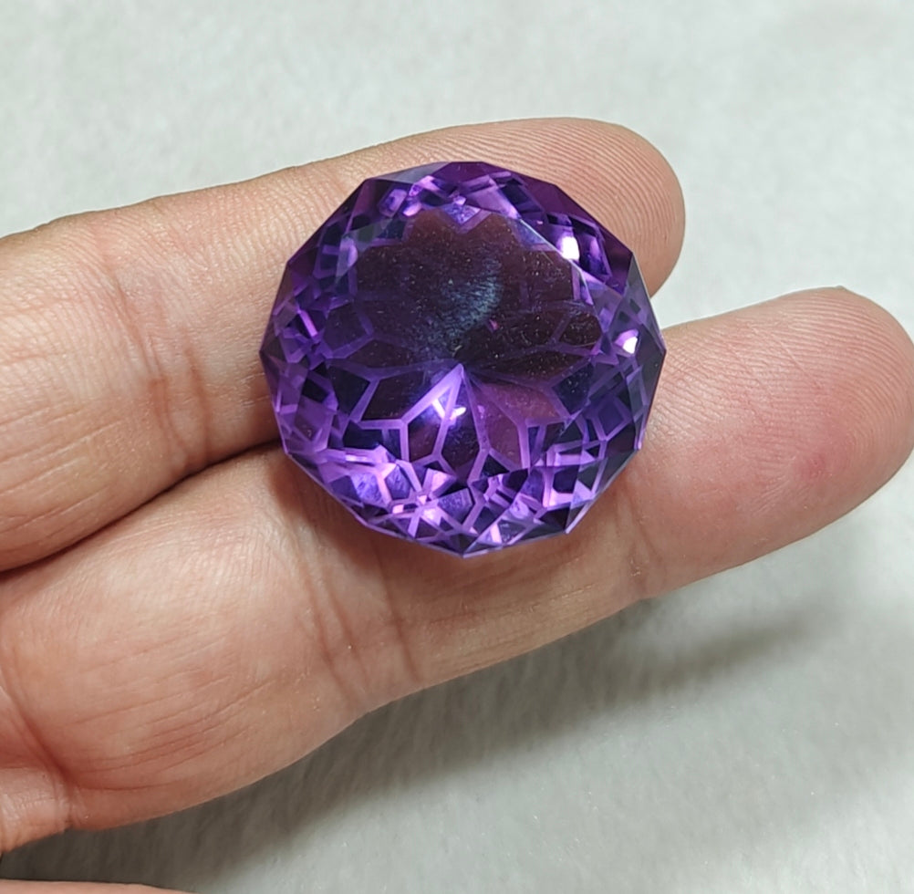 An amazing faceted fancy cut amethyst gemstone 77 carats