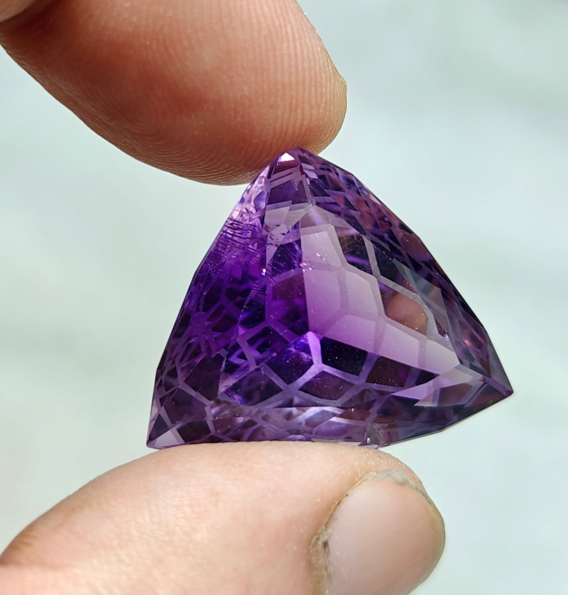 An amazing trillion fancy cut faceted amethyst gemstone 46 carats