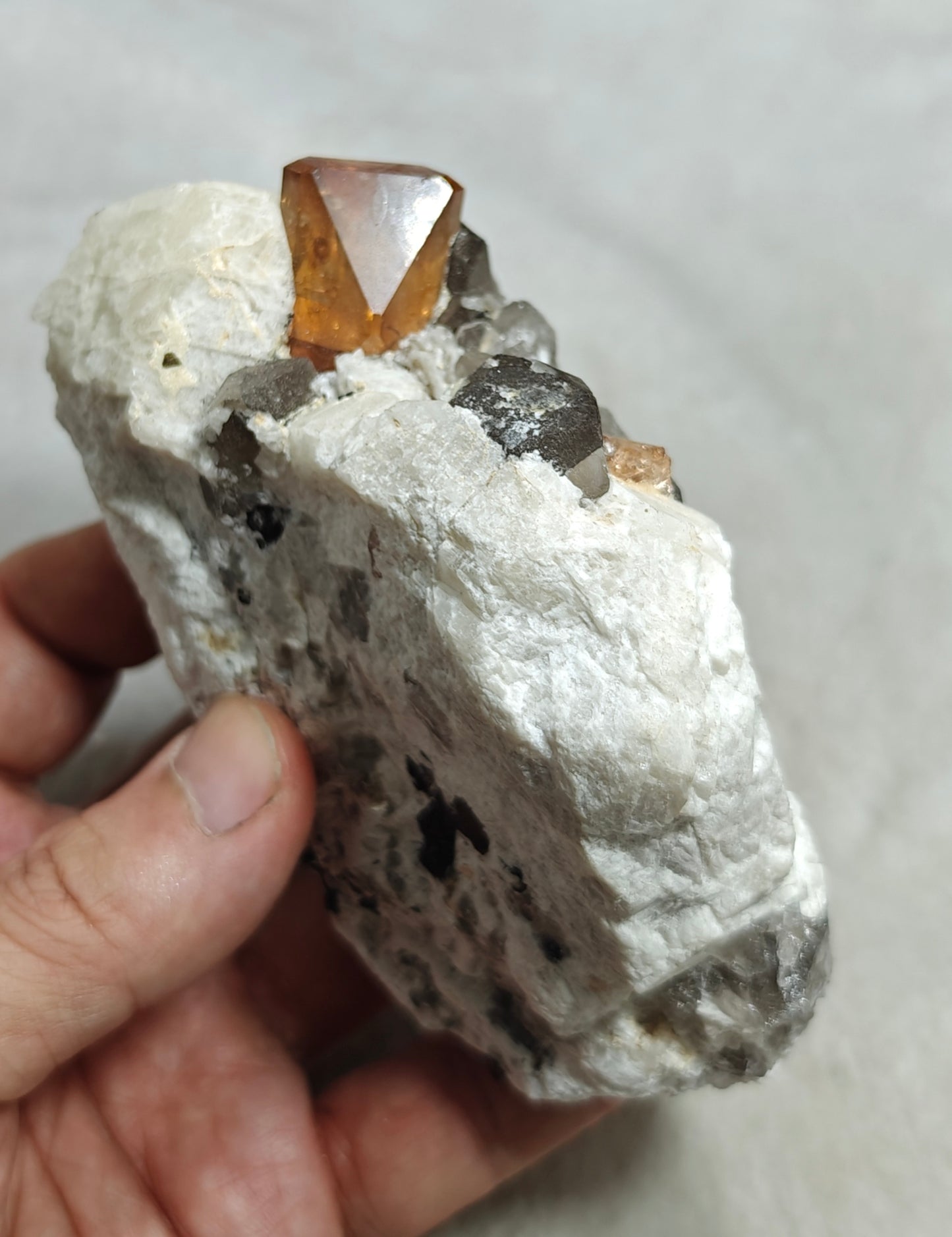 Terminated peach color Topaz crystal on matrix 576 grams