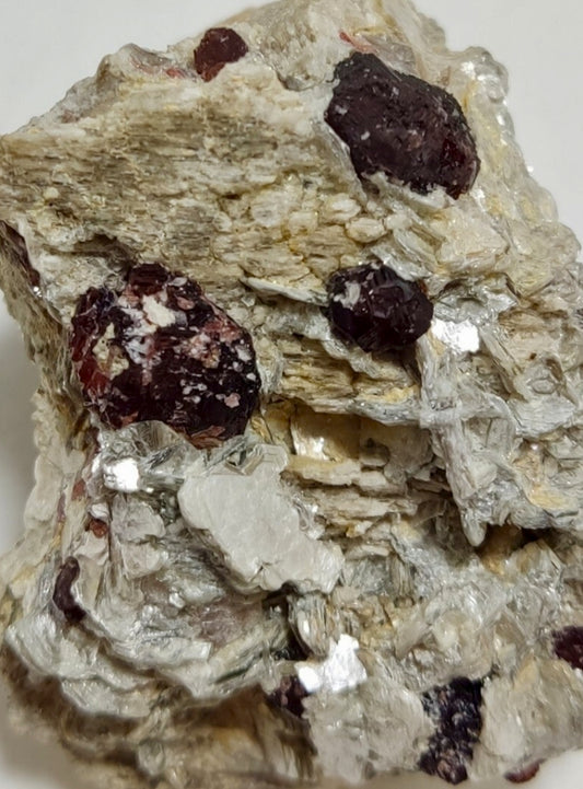 An aesthetic specimen of spessartine garnets on muscovite 59 grams
