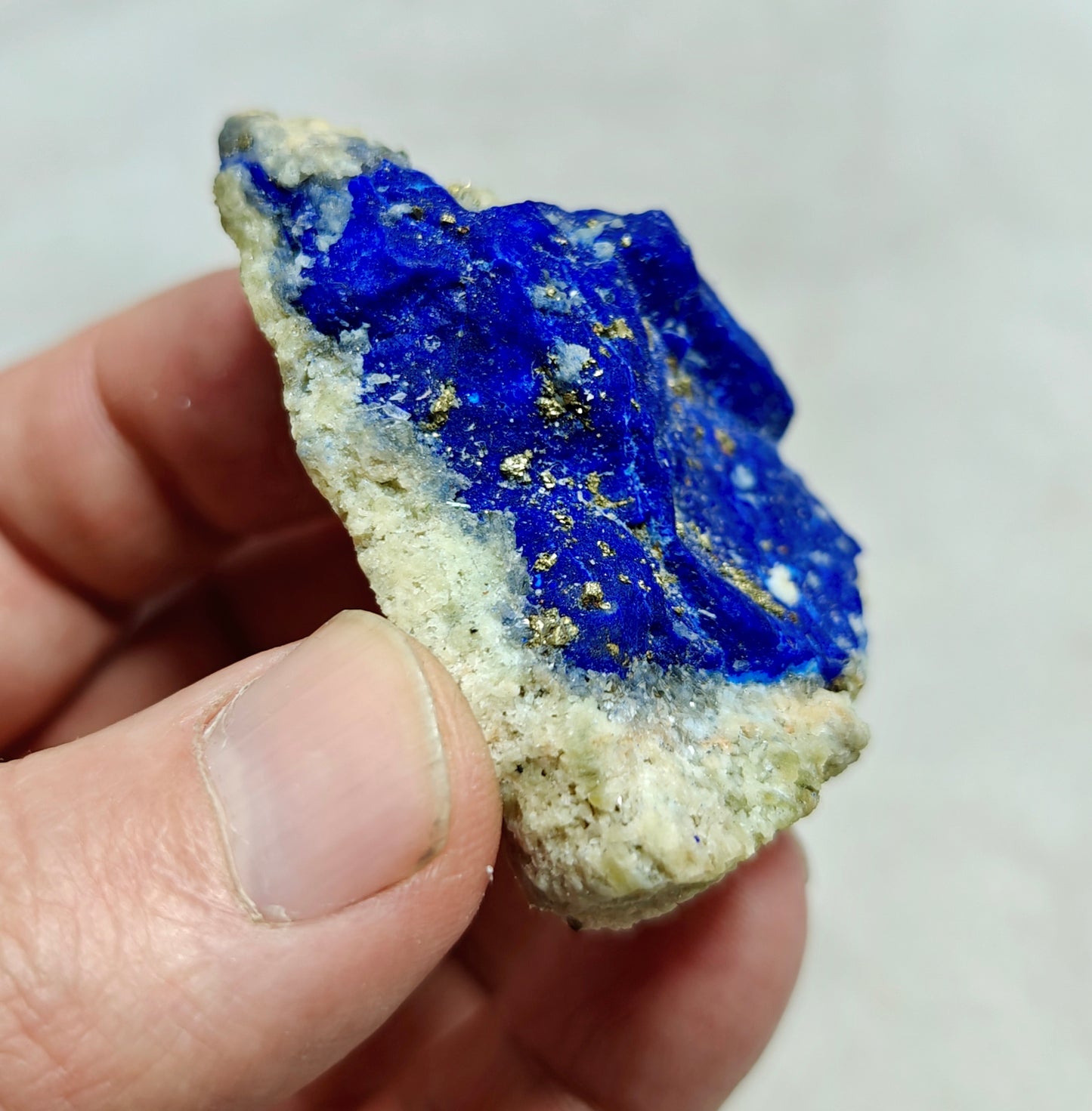 An Aesthetic specimen of Lazurite Lapis with Pyrite partly fluorescent 57g