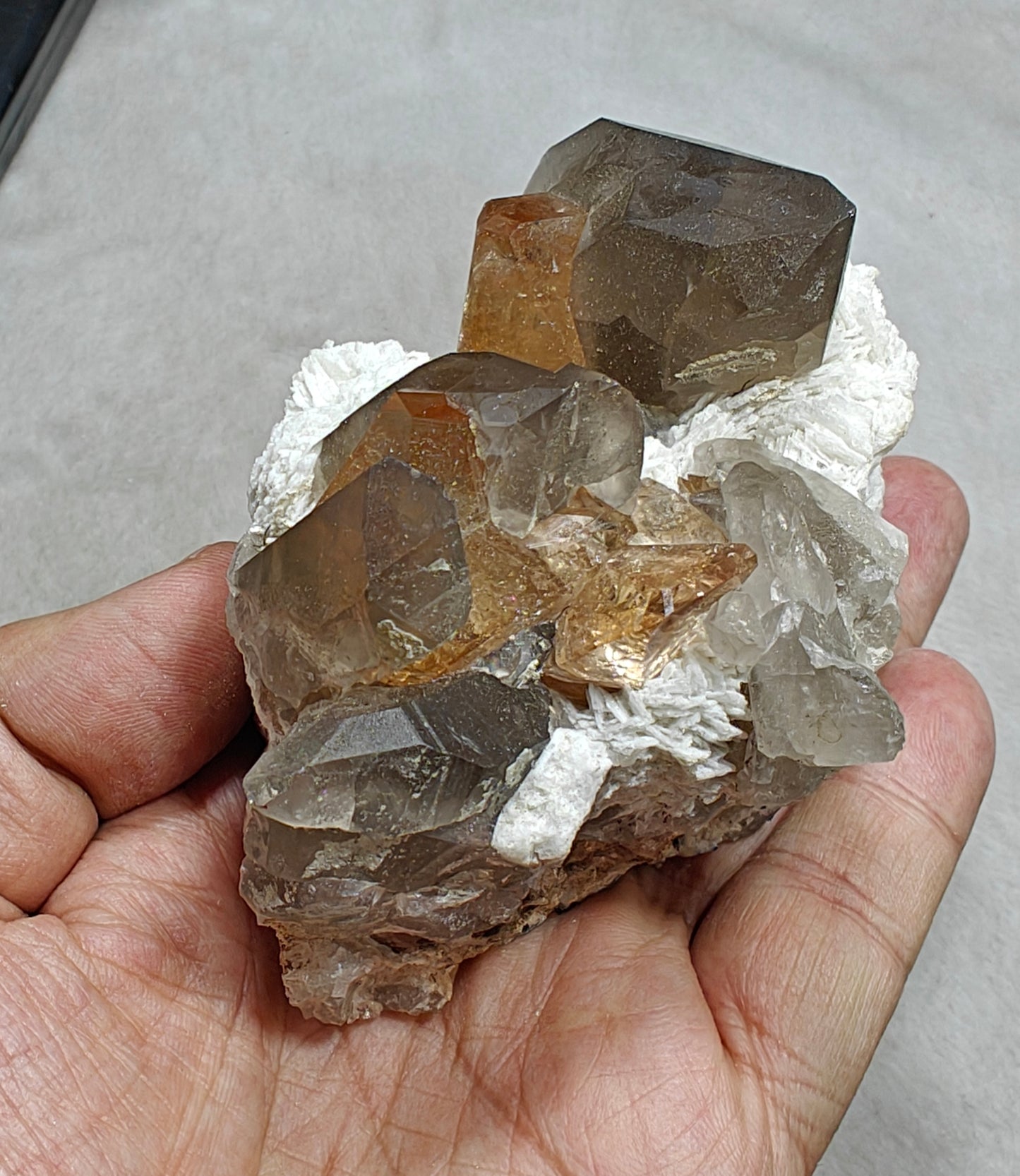 Natural peach color Topaz crystals on matrix with smoky quartz 455 grams