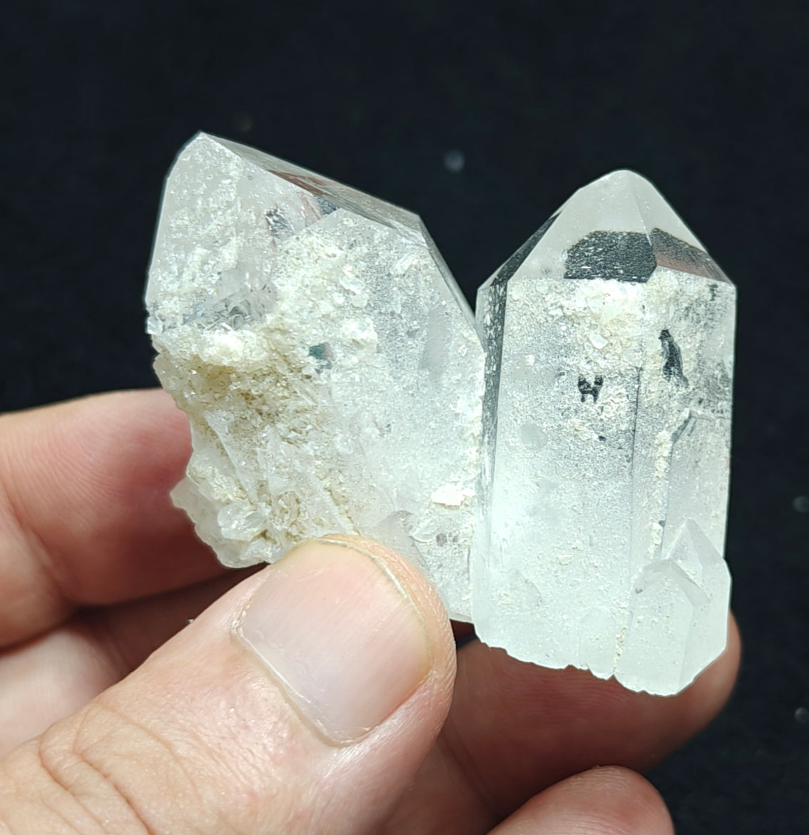 An amazing specimen of twin terminated Quartz Crystals with another small terminated Crystal attached 76 grams