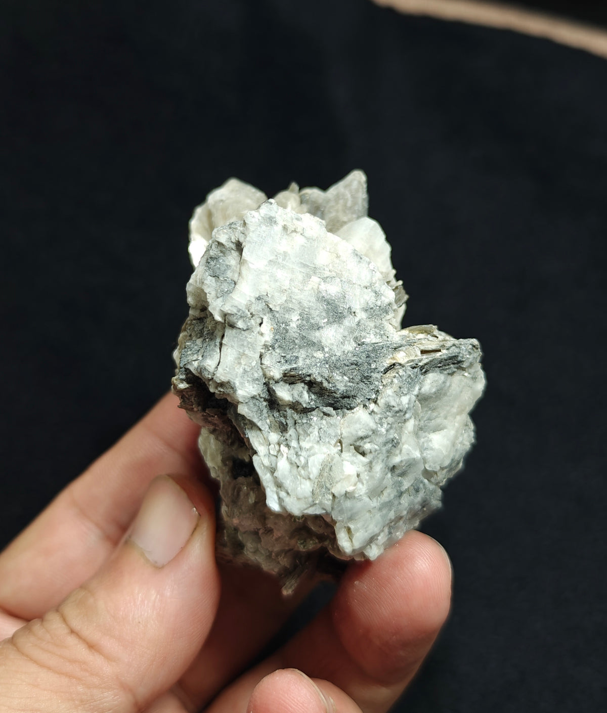 Natural spessartine garnet embedded in muscovite, with albite 150 grams