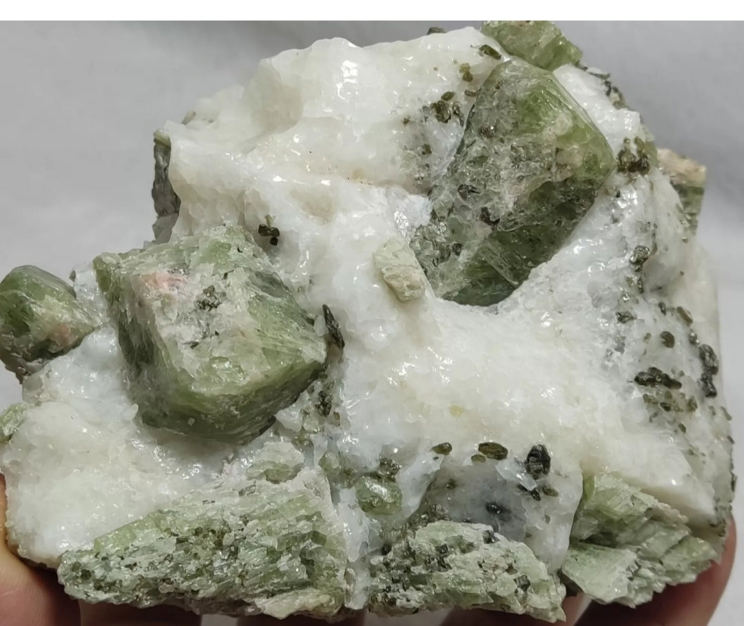 Green diopside crystals on matrix with mica 1067 grams