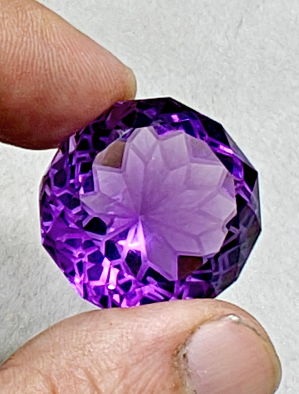 An amazing faceted fancy cut amethyst gemstone 77 carats
