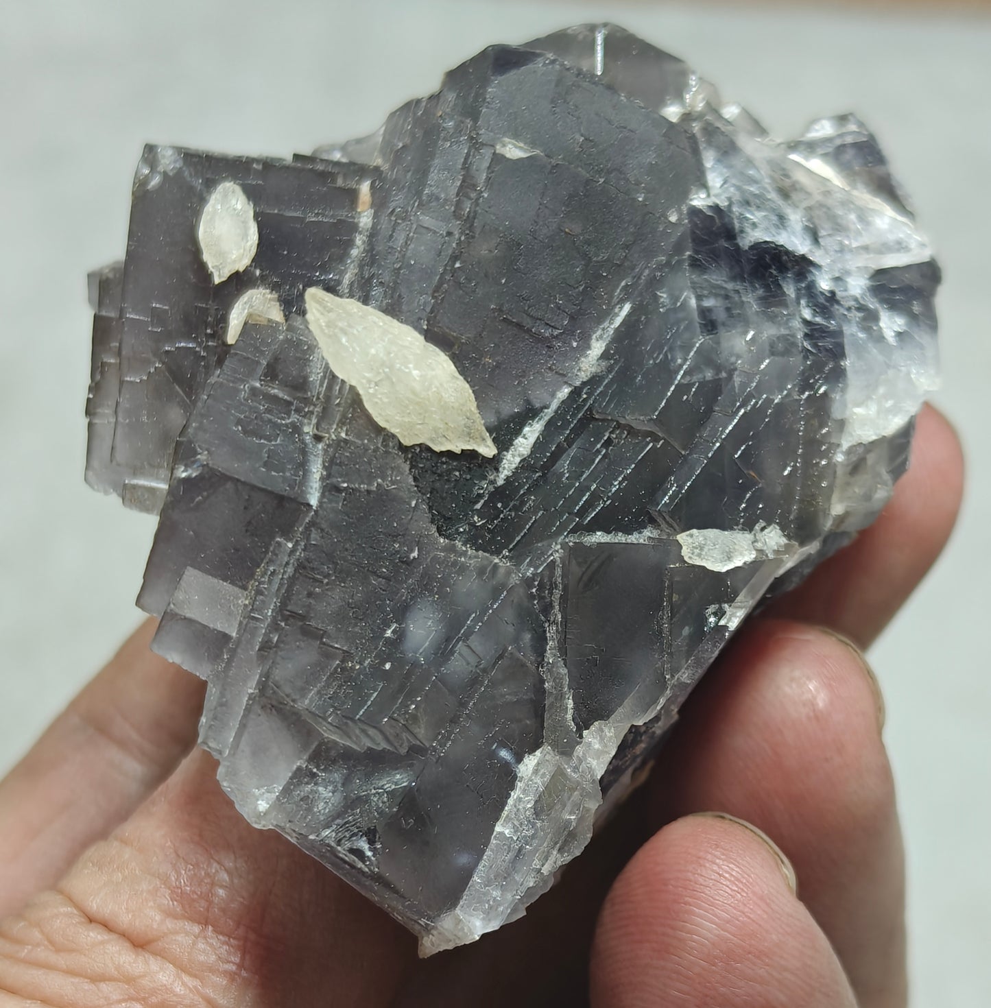 An amazing Single beautiful specimen of grey/purple fluorite with calcite crystals 150 grams