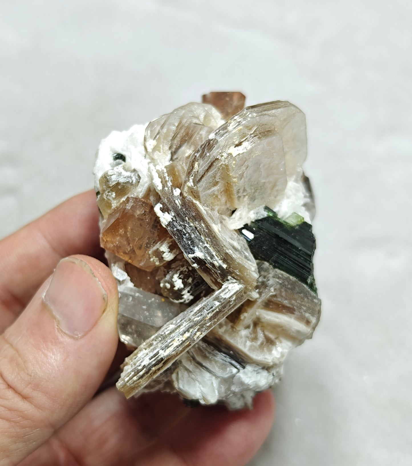 peach color Topaz crystals with quartz and tourmaline 210 grams