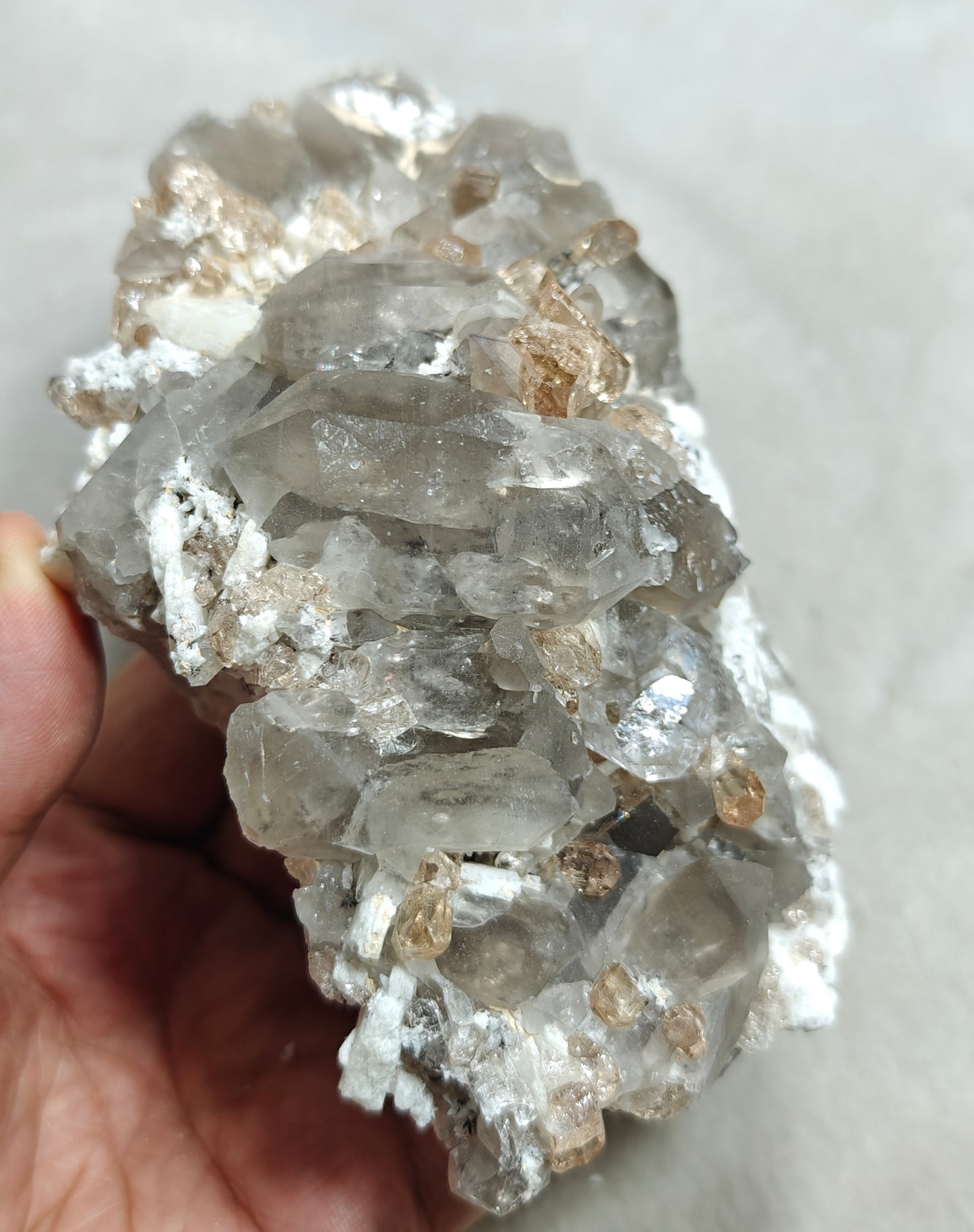 Natural terminated peach color Topaz crystals with smoky quartz on matrix 750 grams