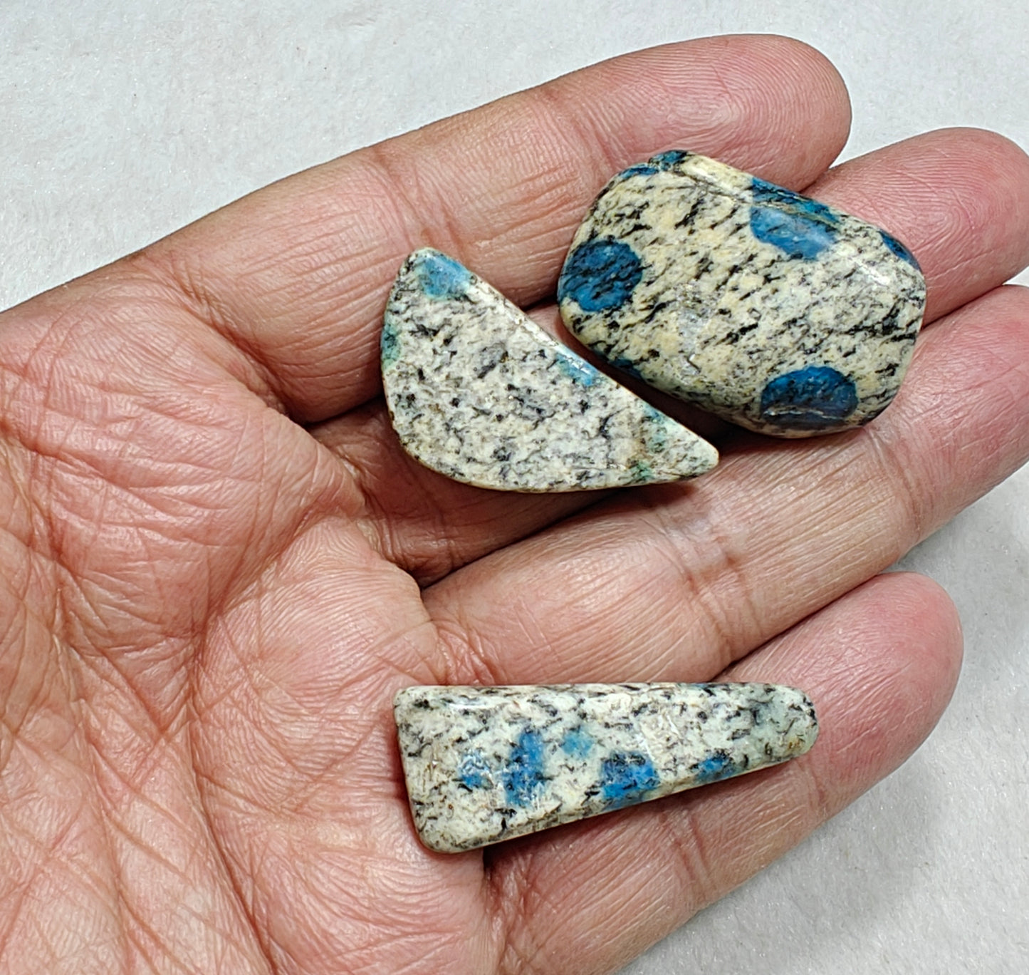 3 Natural K2 stone tumbles also known as Azurite in granite