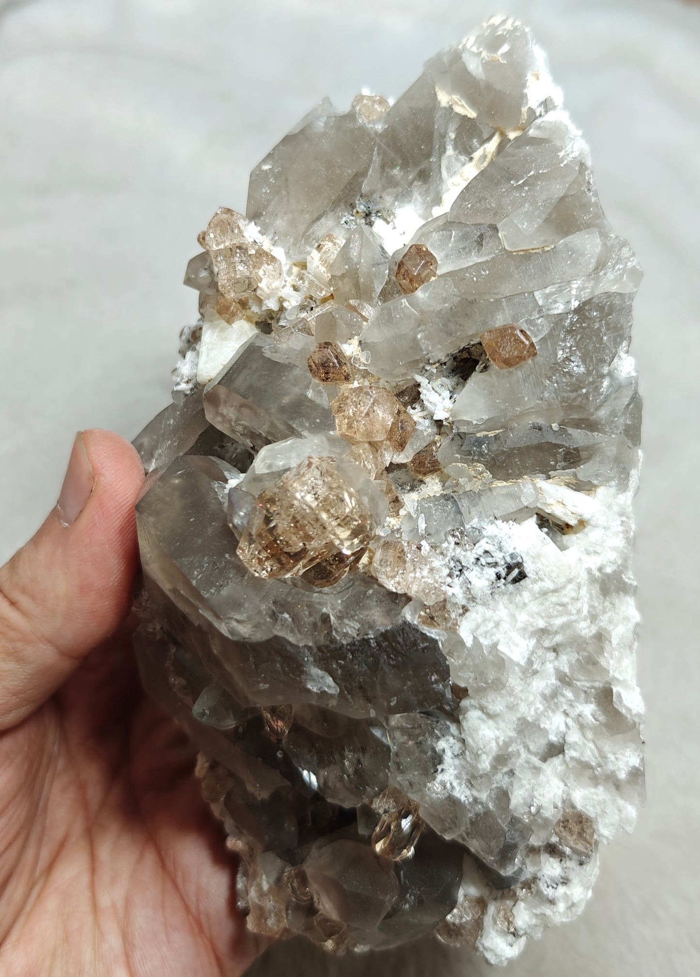 Natural terminated peach color Topaz crystals with smoky quartz on matrix 750 grams