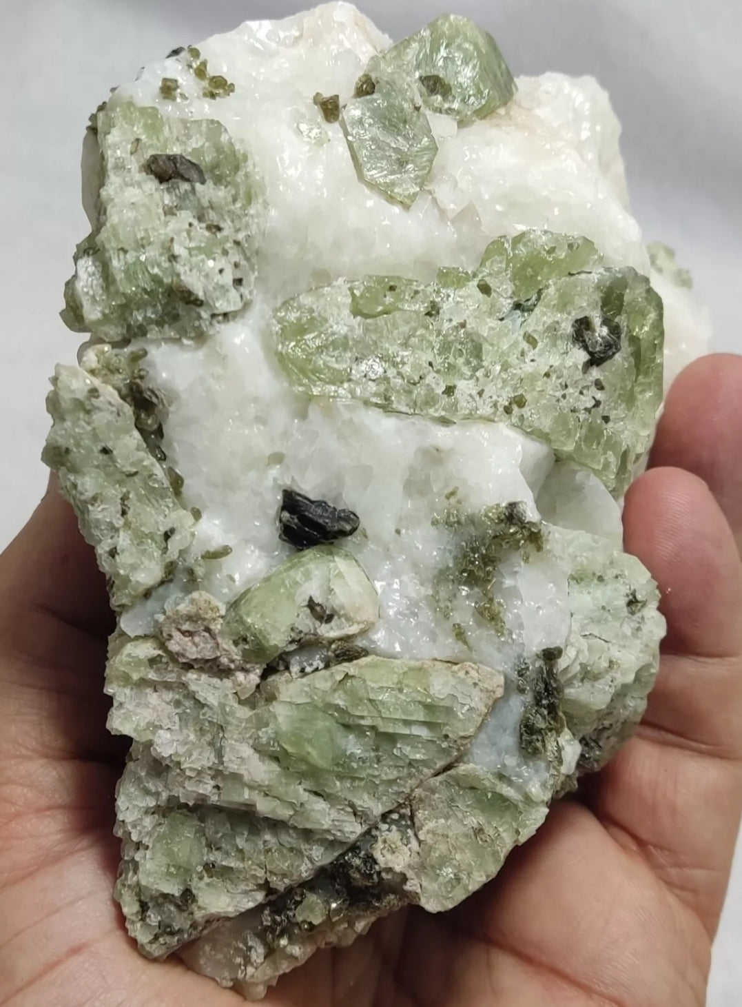 Green diopside crystals on matrix with mica 1067 grams