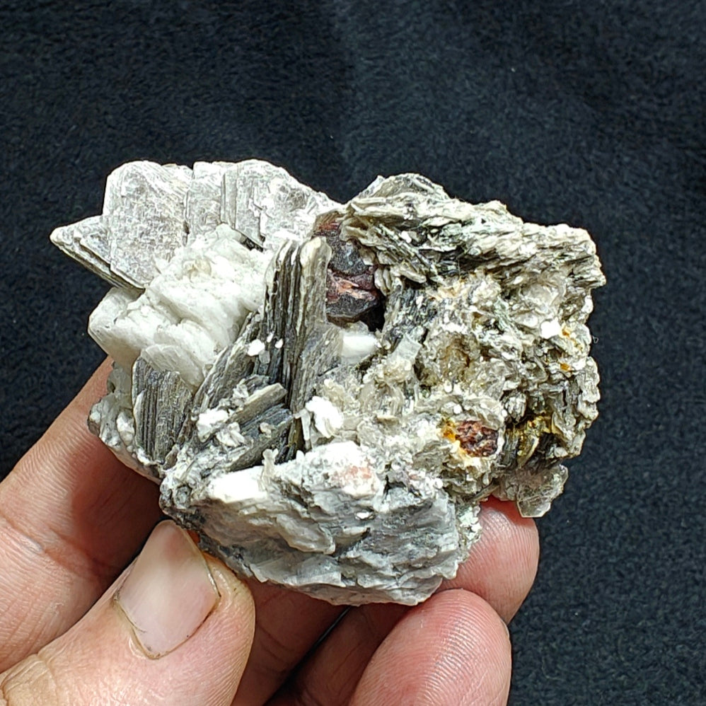 Natural spessartine garnet embedded in muscovite, with albite 150 grams