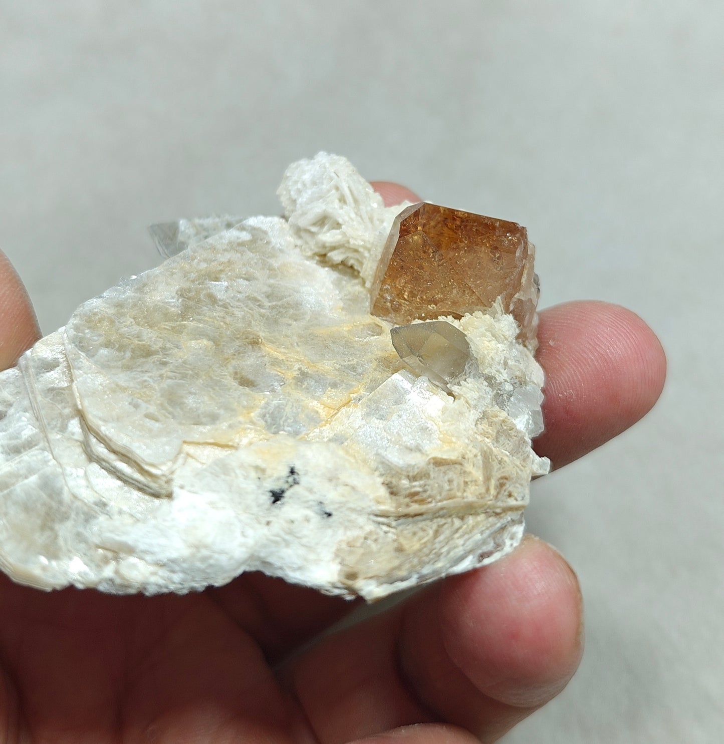 peach color Topaz crystal embedded in muscovite 48 grams