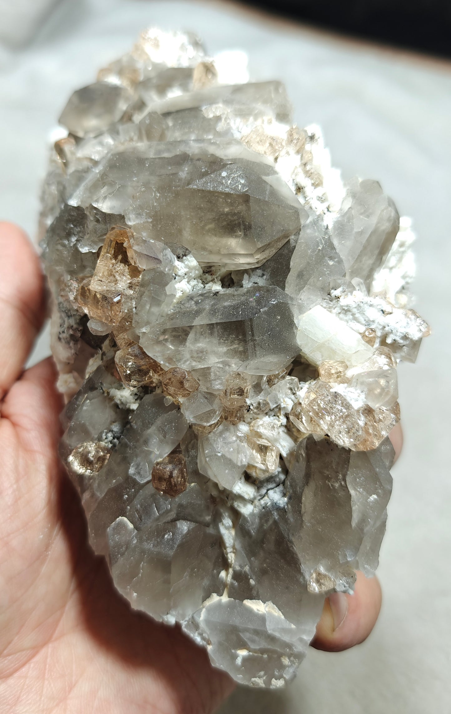 Natural terminated peach color Topaz crystals with smoky quartz on matrix 750 grams
