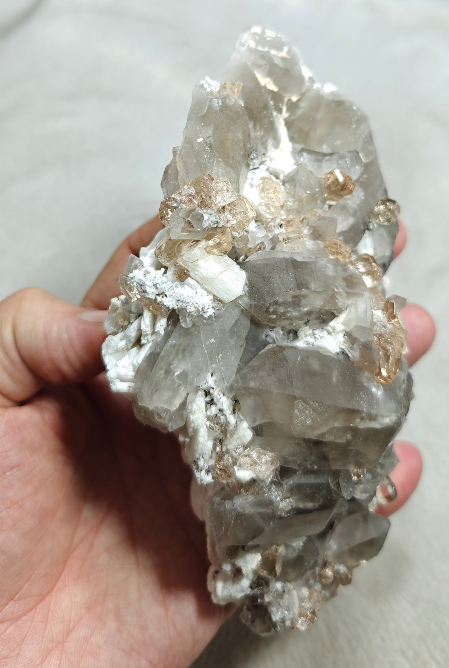 Natural terminated peach color Topaz crystals with smoky quartz on matrix 750 grams