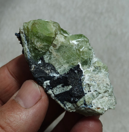 Peridot crystals with magnetite 84 grams
