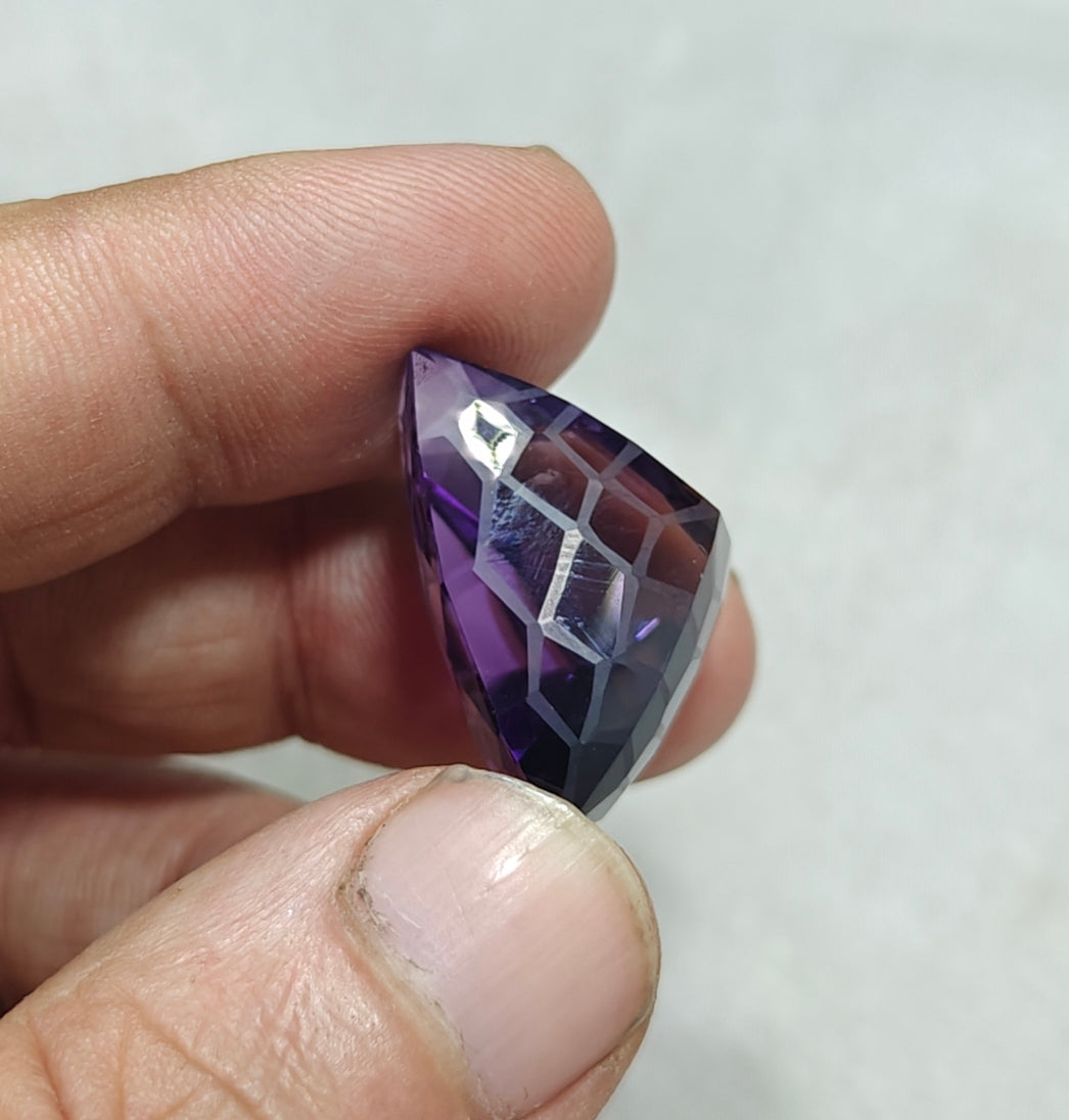 An amazing trillion fancy cut faceted amethyst gemstone 46 carats