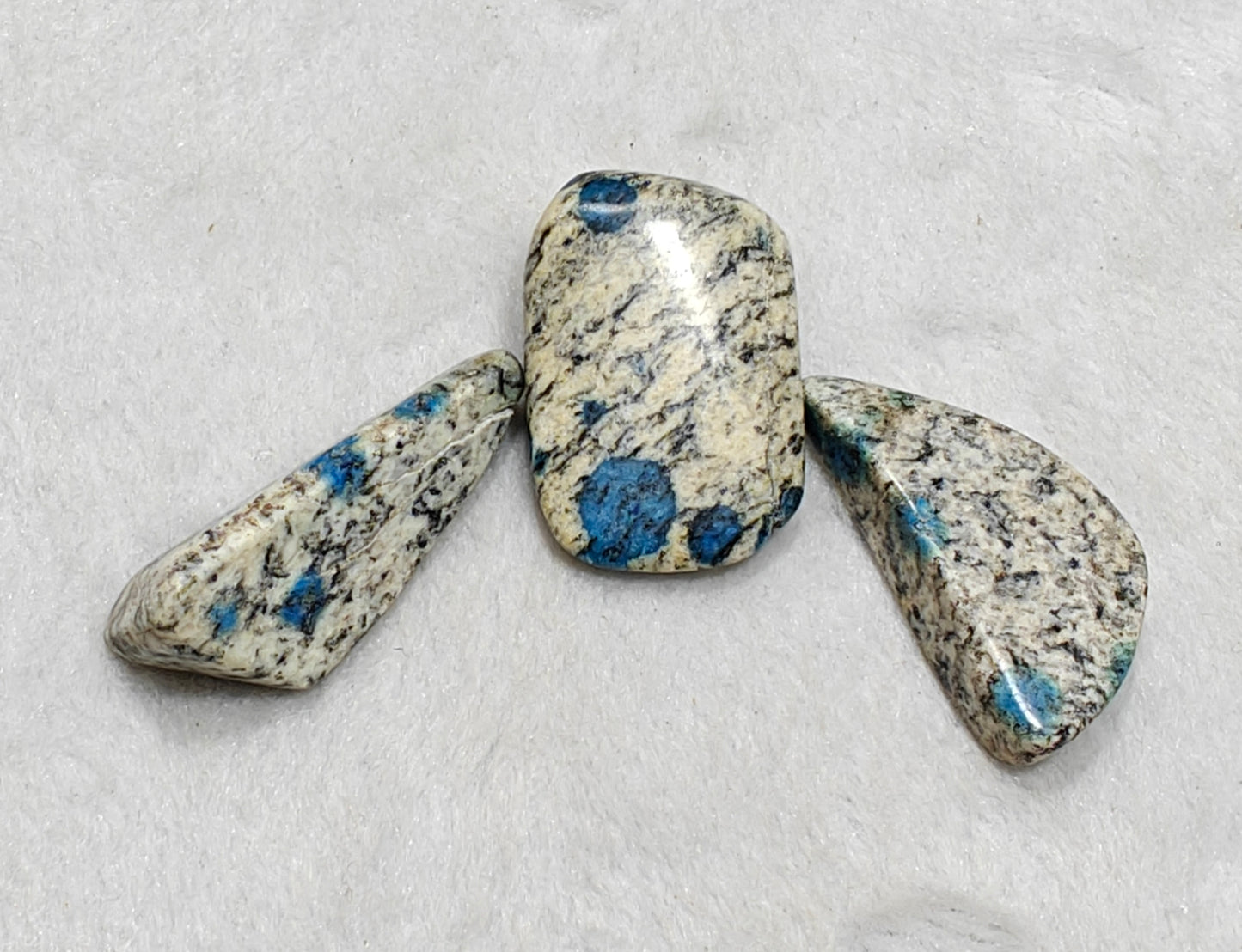 3 Natural K2 stone tumbles also known as Azurite in granite