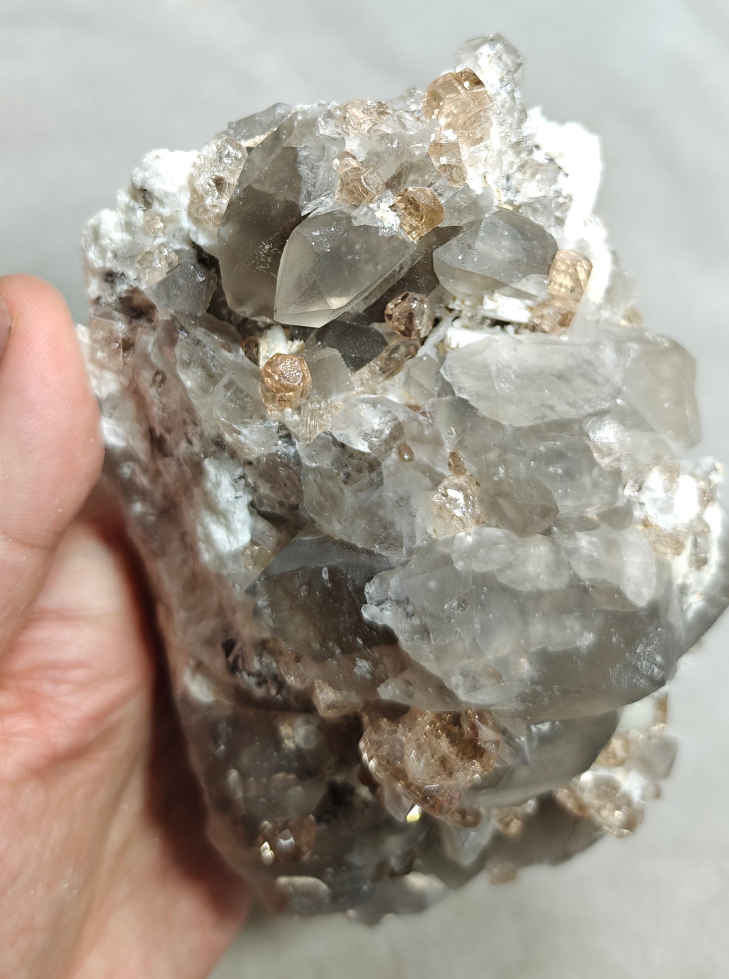 Natural terminated peach color Topaz crystals with smoky quartz on matrix 750 grams