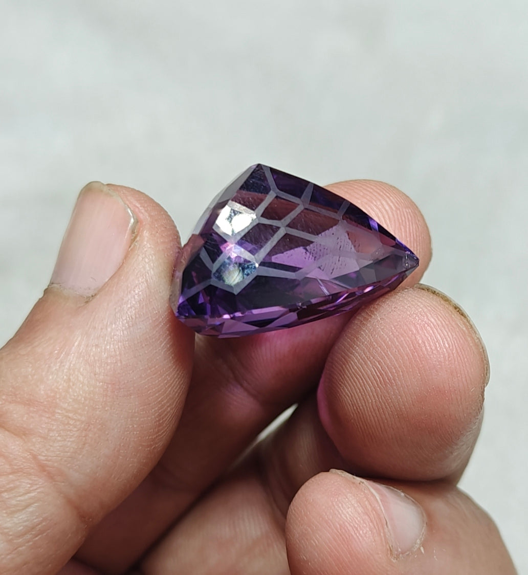 An amazing trillion fancy cut faceted amethyst gemstone 46 carats