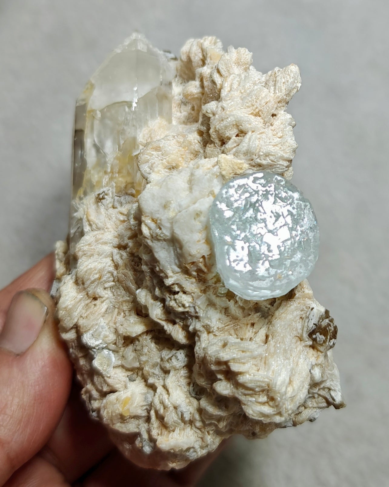 An aesthetic Specimen of etched Aquamarine on matrix with quartz 206 grams