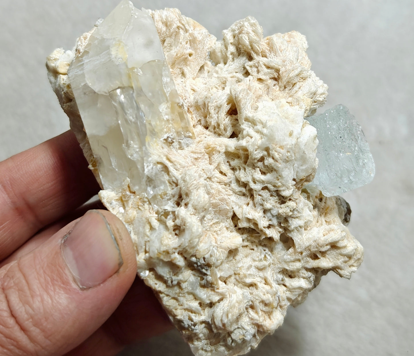 An aesthetic Specimen of etched Aquamarine on matrix with quartz 206 grams