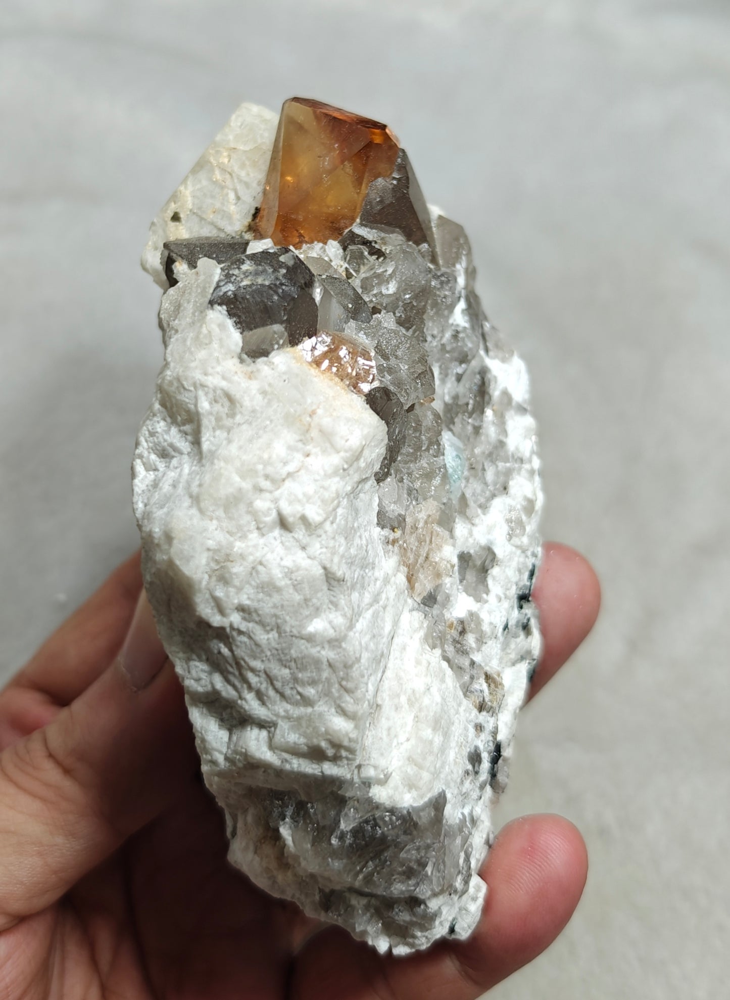 Terminated peach color Topaz crystal on matrix 576 grams