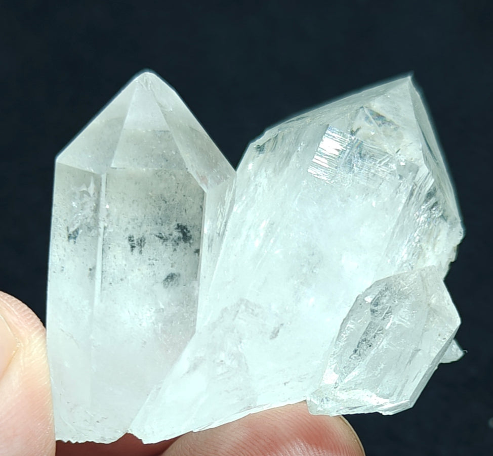 An amazing specimen of twin terminated Quartz Crystals with another small terminated Crystal attached 76 grams