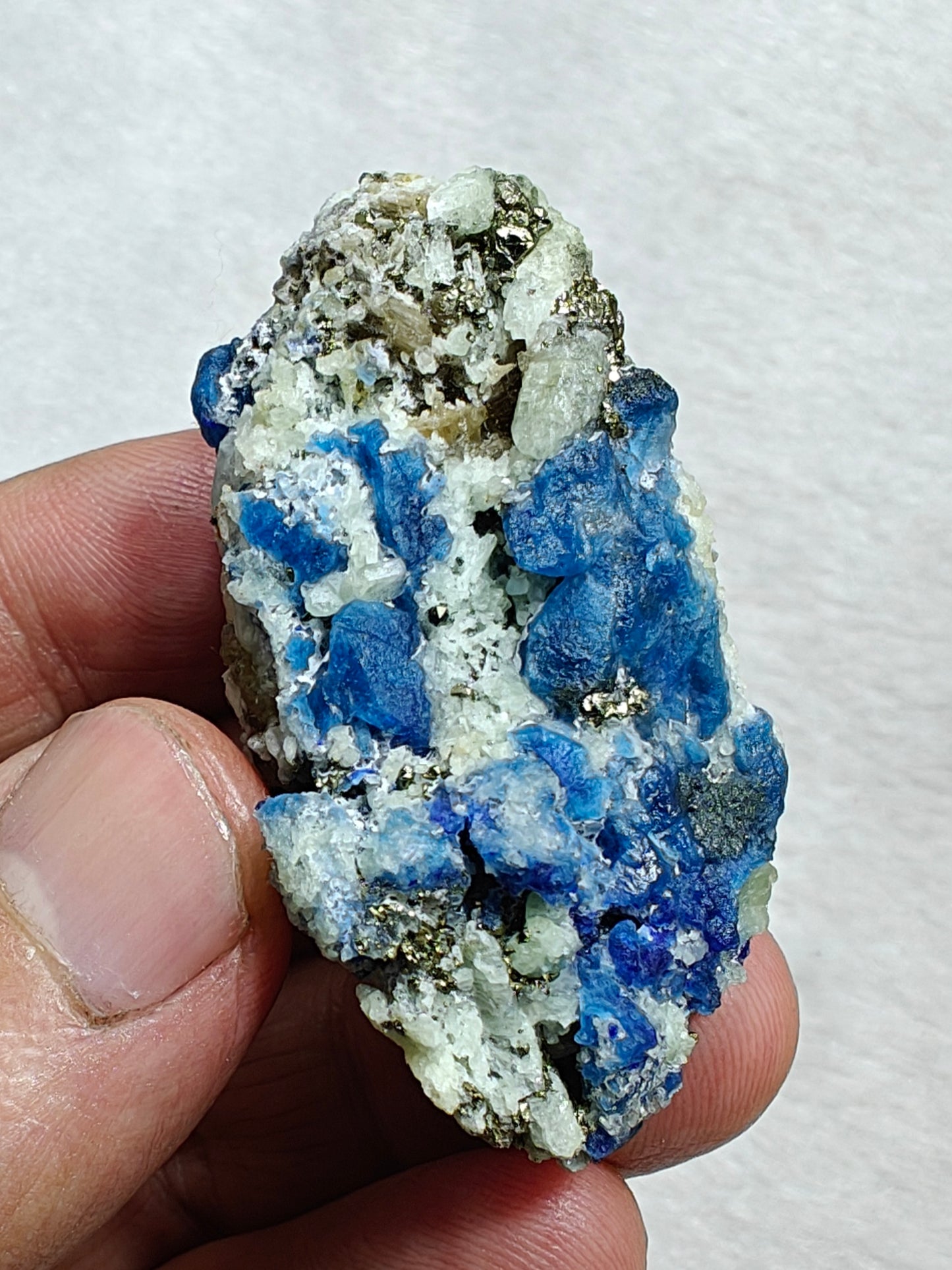 Afghanite Fluorescent in matrix with some pyrite and phlogopite 41 grams