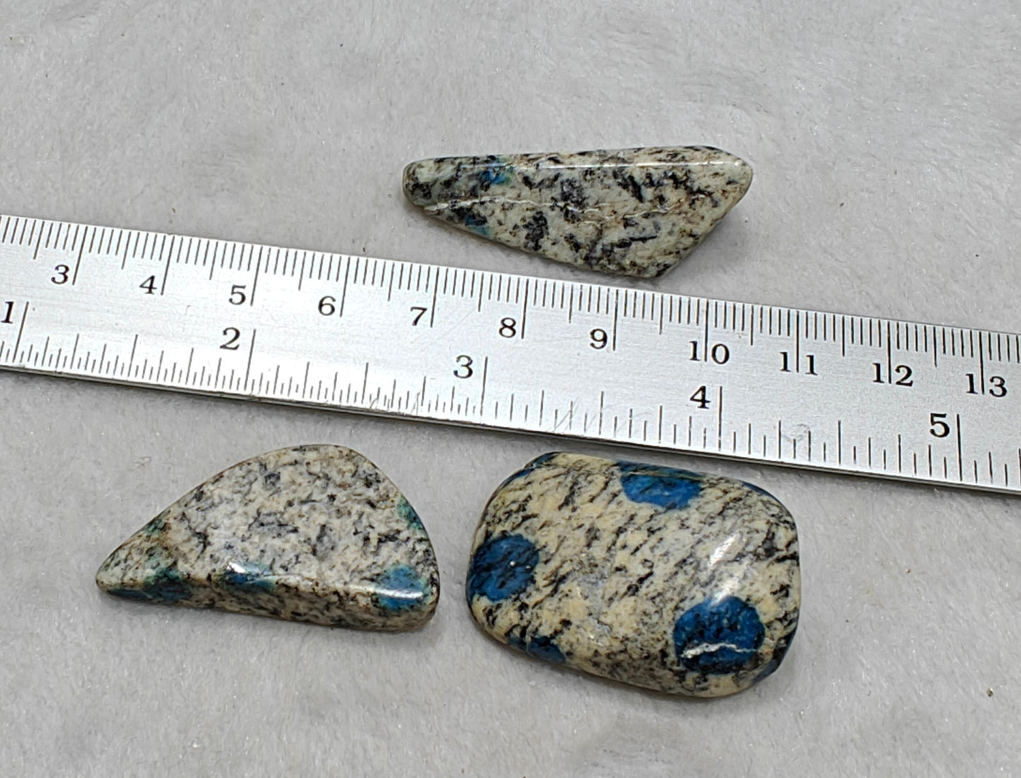 3 Natural K2 stone tumbles also known as Azurite in granite