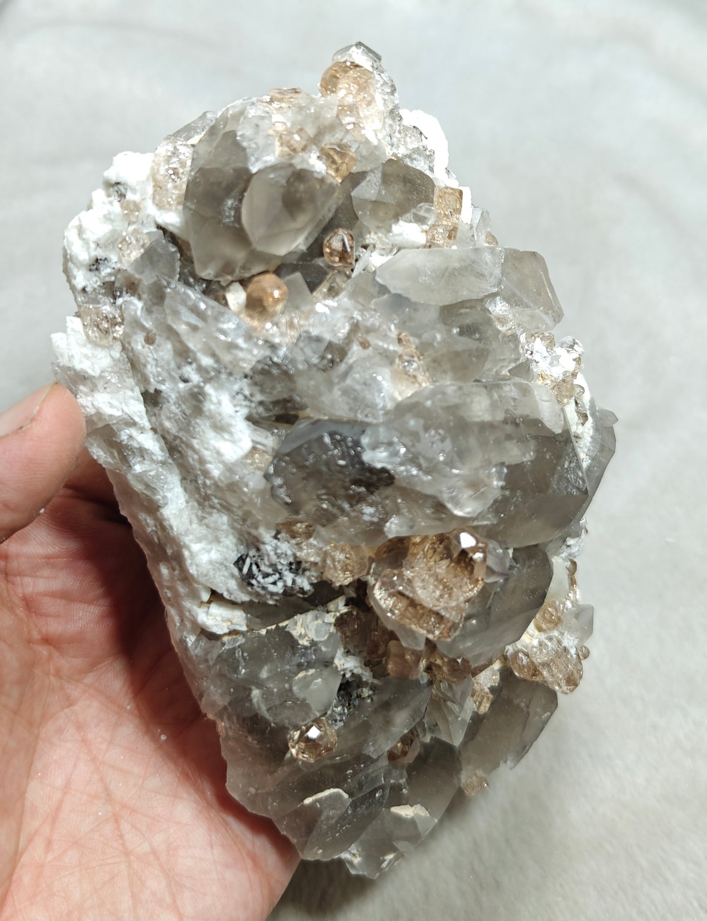Natural terminated peach color Topaz crystals with smoky quartz on matrix 750 grams