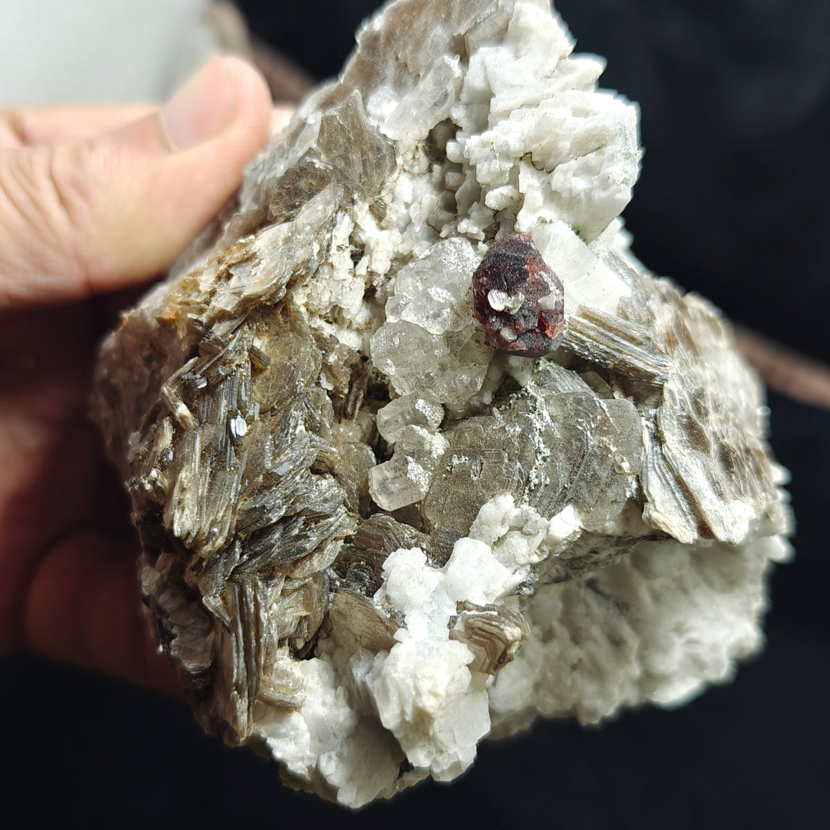 Natural spessartine garnet embedded in muscovite, with albite and quartz 544 grams