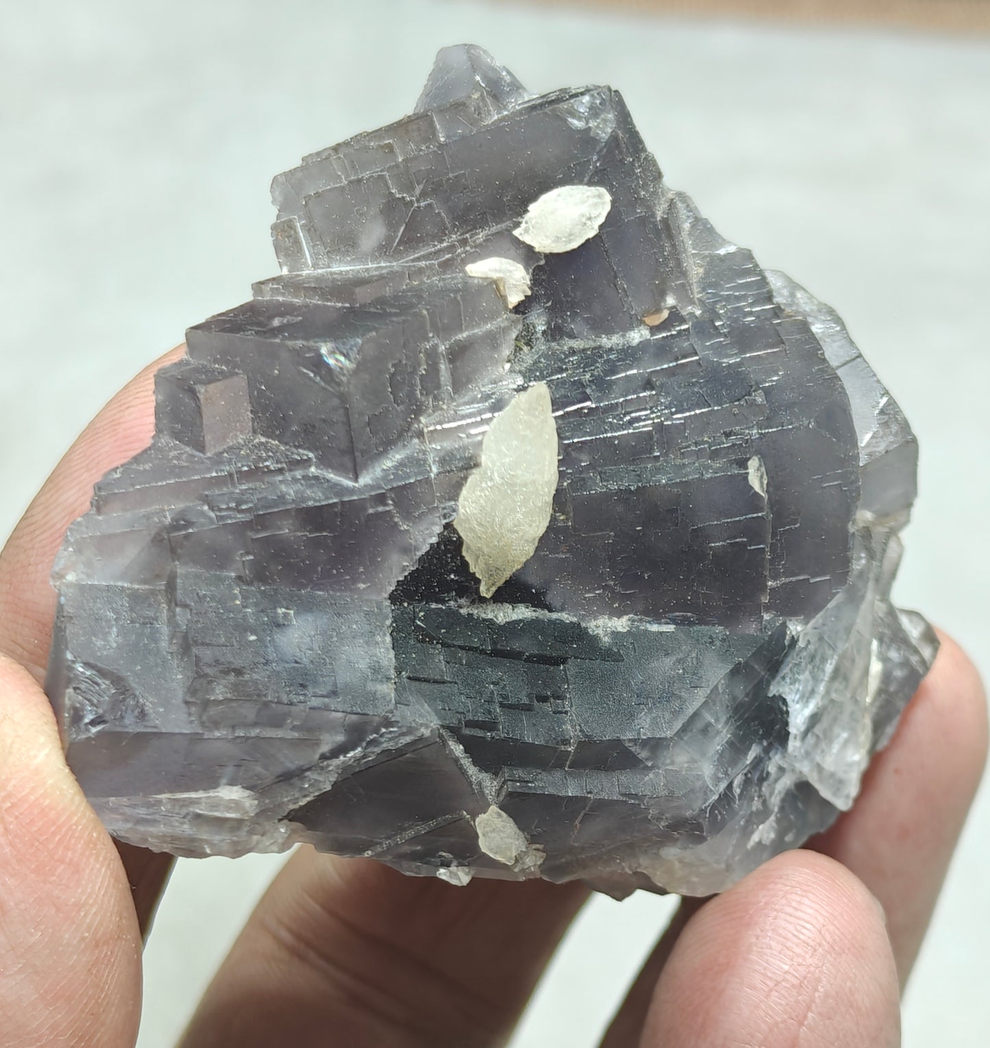 An amazing Single beautiful specimen of grey/purple fluorite with calcite crystals 150 grams