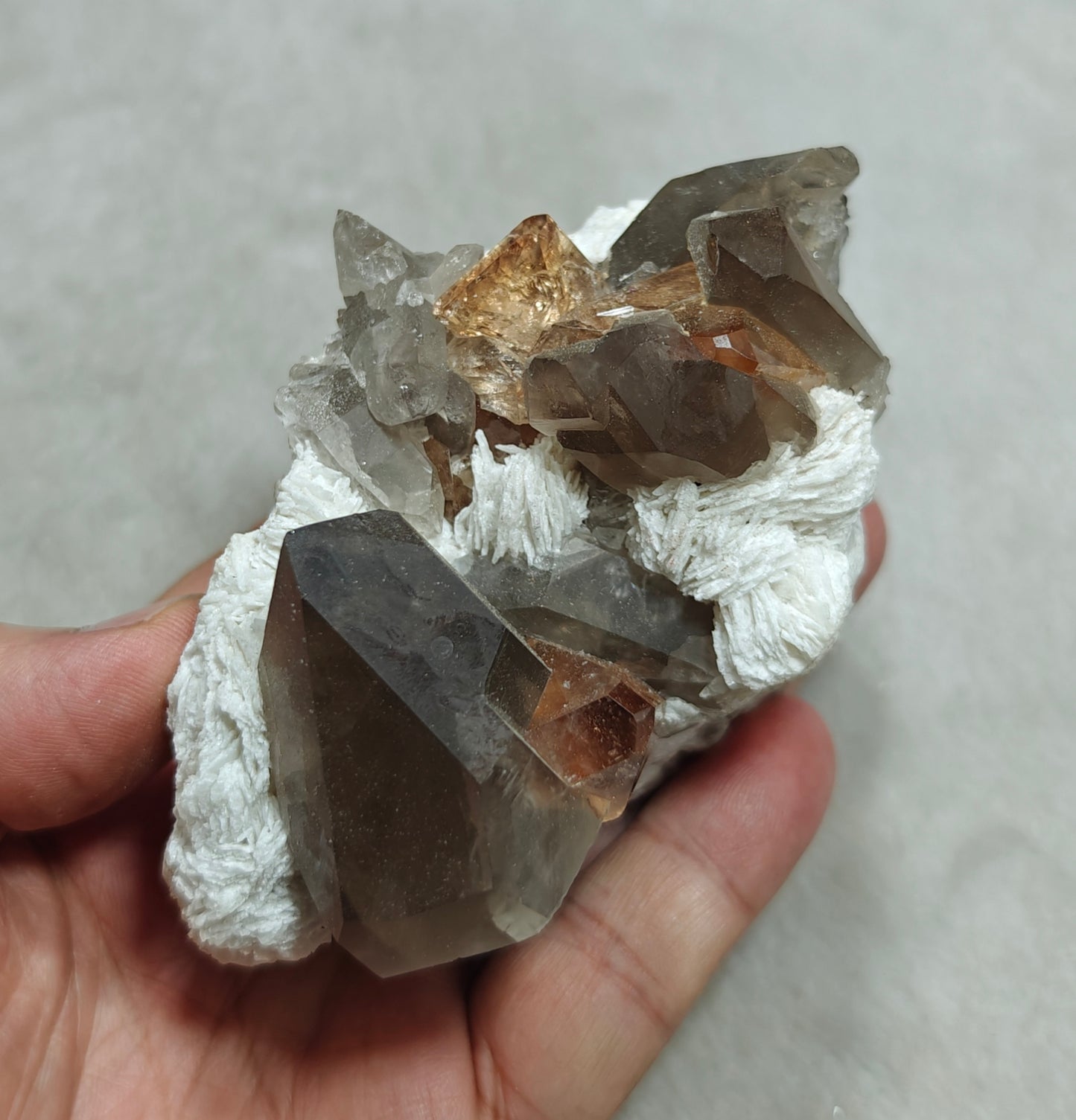 Natural peach color Topaz crystals on matrix with smoky quartz 455 grams