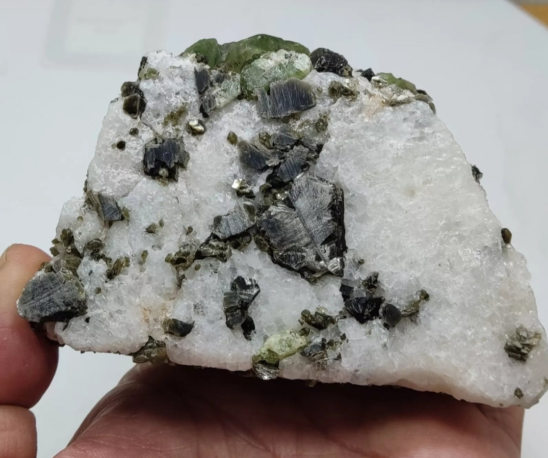 Diopside crystals on matrix with black/dark brown mica 811 grams