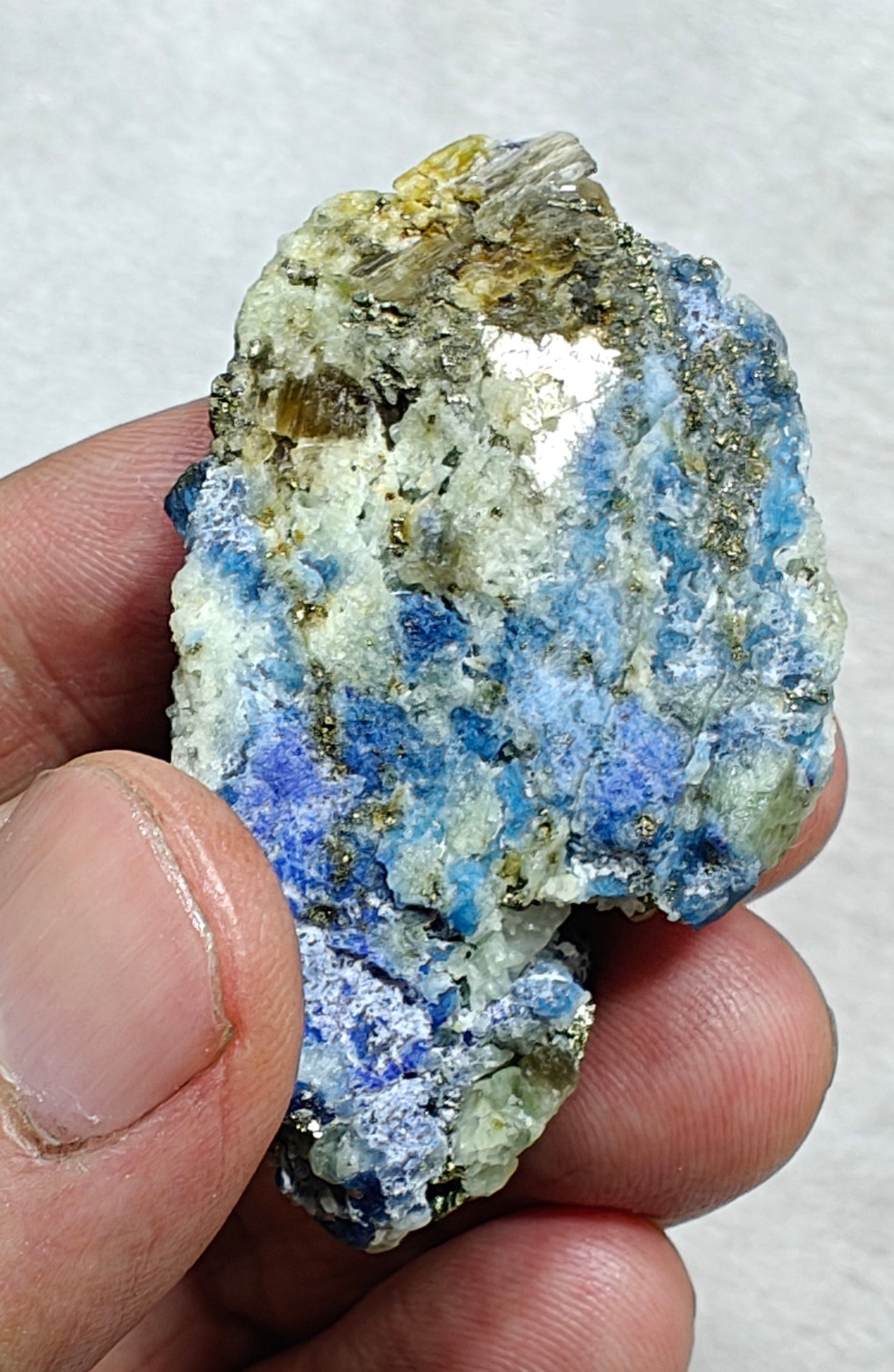 Afghanite Fluorescent in matrix with some pyrite and phlogopite 41 grams