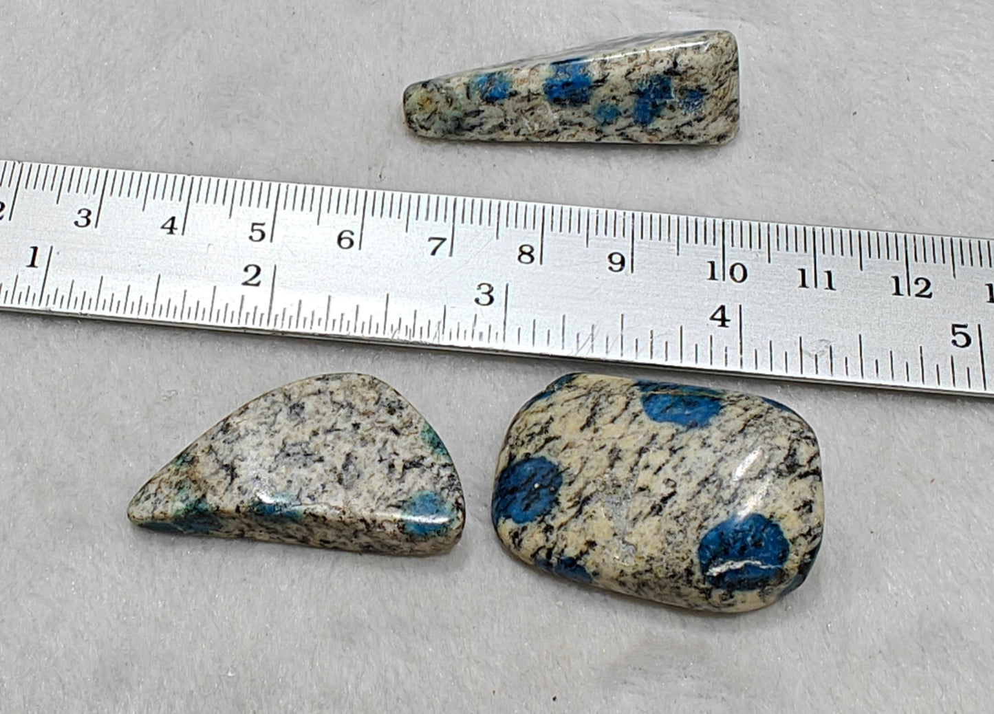 3 Natural K2 stone tumbles also known as Azurite in granite