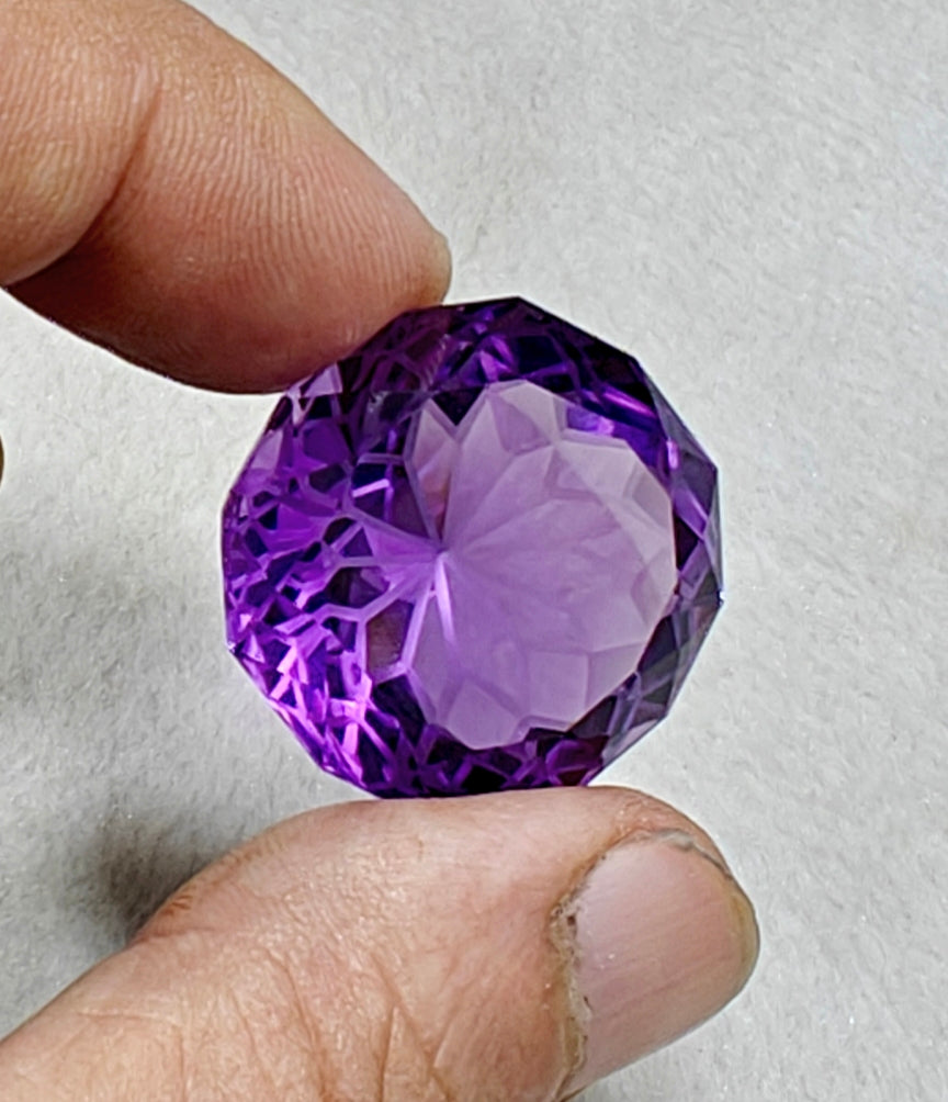 An amazing faceted fancy cut amethyst gemstone 77 carats