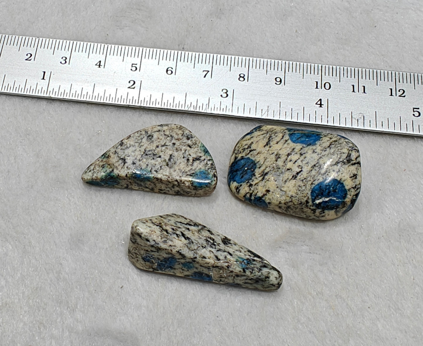 3 Natural K2 stone tumbles also known as Azurite in granite