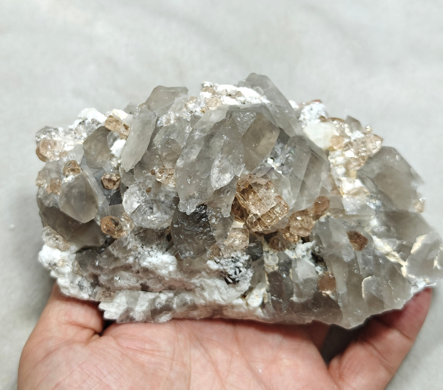 Natural terminated peach color Topaz crystals with smoky quartz on matrix 750 grams
