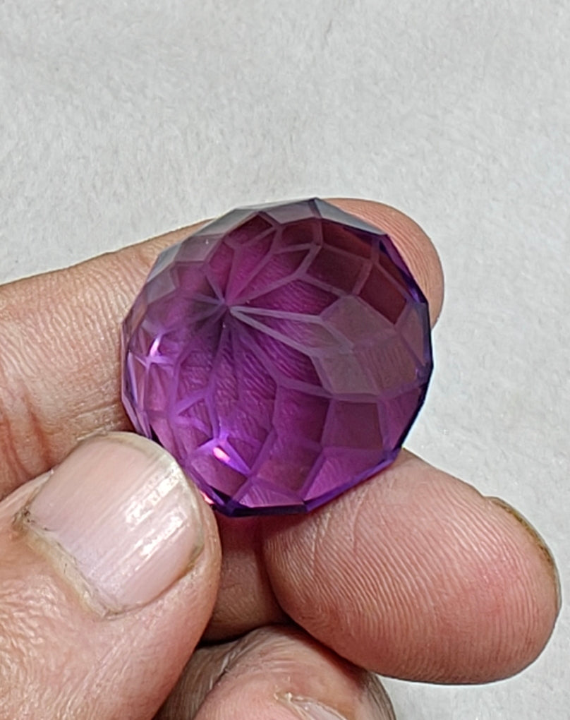 An amazing faceted fancy cut amethyst gemstone 77 carats