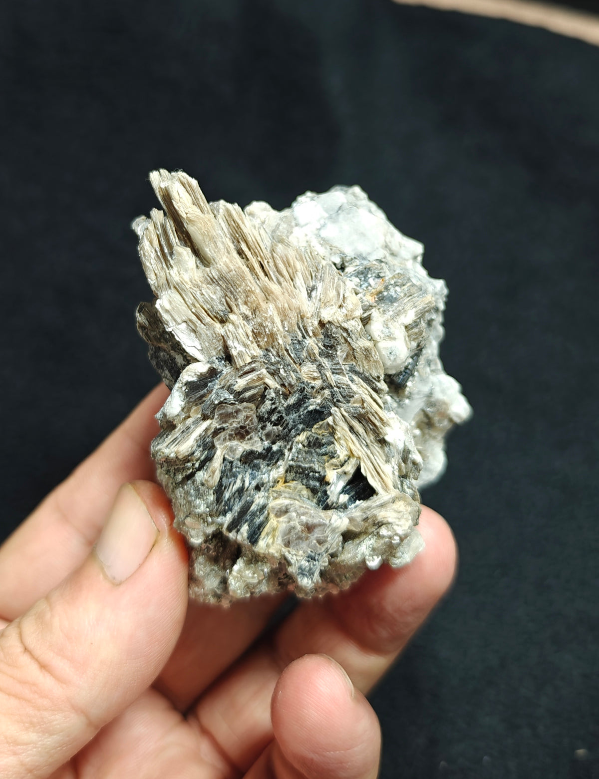 Natural spessartine garnet embedded in muscovite, with albite 150 grams