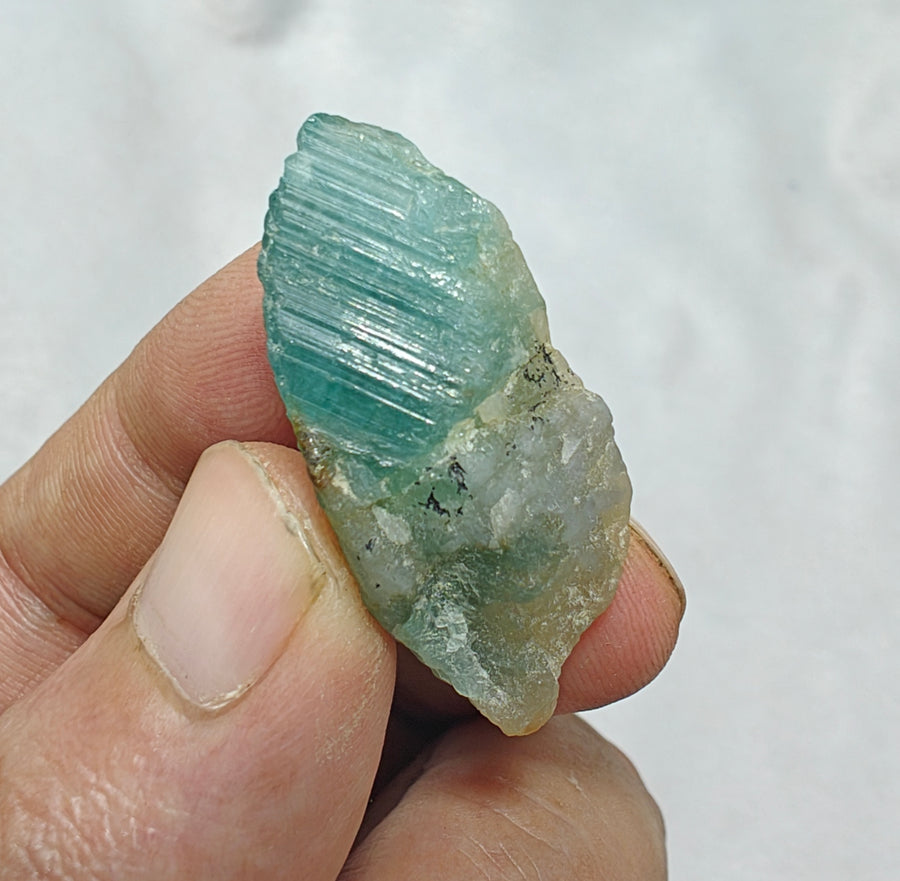 Blue-green natural crystal specimen illustrating the beauty of coloured minerals