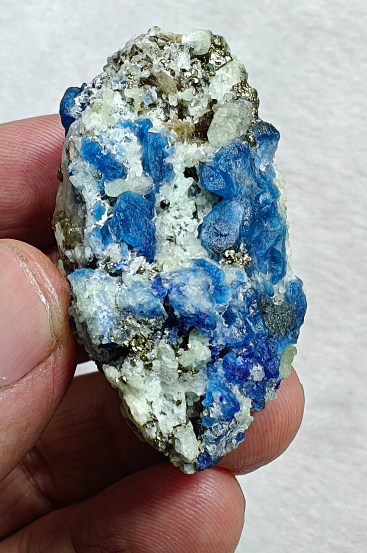 Afghanite Fluorescent in matrix with some pyrite and phlogopite 41 grams
